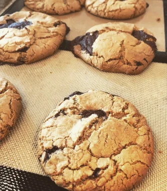 A tray of fresh-baked chocolate chunk cookies